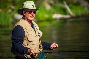 senior man fishing after resolving urinary issues with support of low testosterone treatment