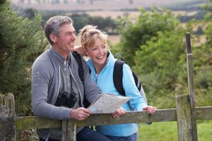 man and woman enjoying stress-free walk after testosterone replacement