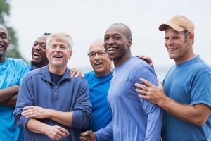 group of men improving well-being through men's health clinic